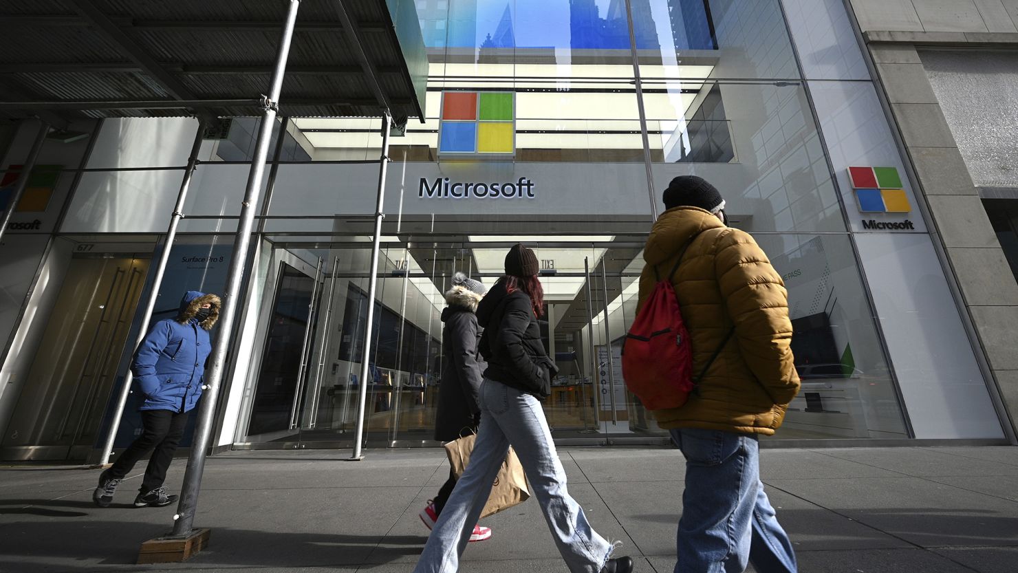 People walk past Microsoft Corp. Fifth Avenue retail store in New York, NY, January 24, 2022.