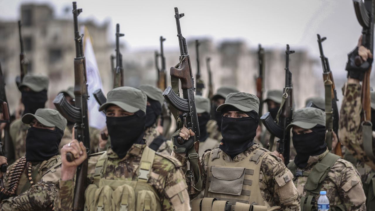 17 February 2022, Syria, Idlib city: Fighters from the Popular Resistance Brigades take part in a military parade in Idlib city during their graduation from a military course in the presence of the Prime Minister of the Syrian Salvation Government. Photo by: Anas Alkharboutli/picture-alliance/dpa/AP Images