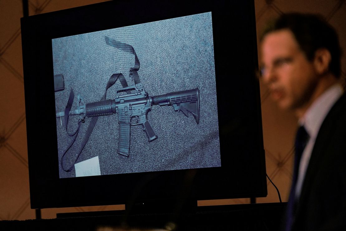 An image of the weapon used during the Sandy Hook school shooting is displayed while attorney Josh Koskoff speaks during a news conference in Trumbull, Connecticut, on February 15, 2022.