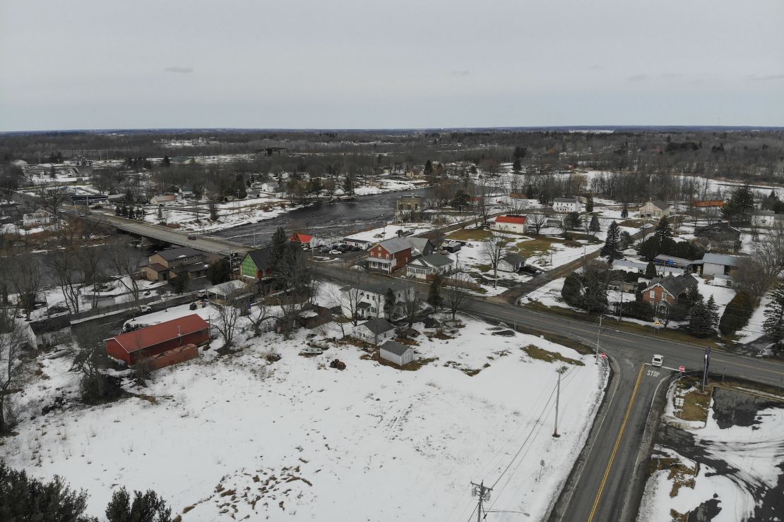 Cars travel along the main road and over the St. Regis River, left, through the reservation Mohawks call Akwesasne, Tuesday, March 15, 2022. (AP Photo/Seth Wenig)