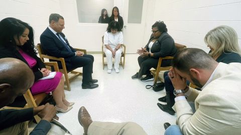 In this April 6, 2022 photo provided by Texas state Rep. Jeff Leach, Texas death row inmate Melissa Lucio, dressed in white, leads a group of seven Texas lawmakers in prayer in a room at the Mountain View Unit in Gatesville, Texas. The lawmakers visited Lucio to update her about their efforts to stop her April 27 execution. The lawmakers say they are troubled by Lucioâs case and believe her execution should be stopped as there are legitimate questions about whether she is guilty. (Texas state Rep. Jeff Leach via AP)