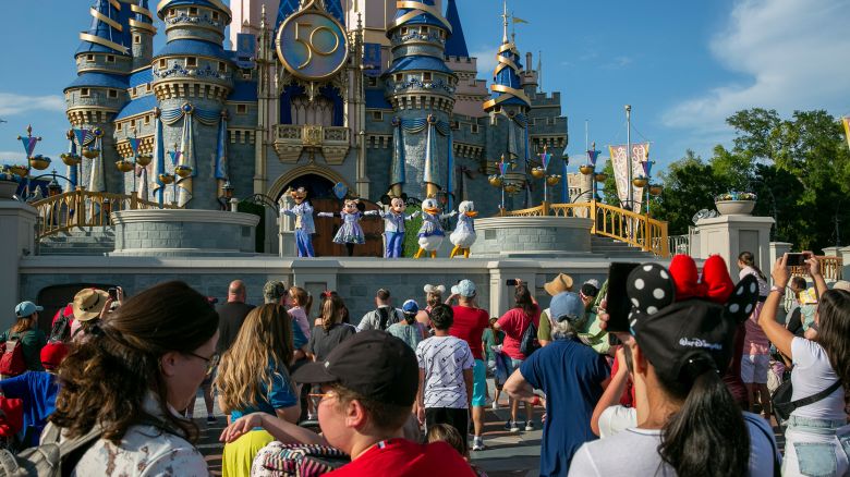 Performers dressed as Mickey Mouse, Minnie Mouse, Goofy, Donald Duck and Daisy Duck entertain visitors at Cinderella Castle at Walt Disney World Resort in Lake Buena Vista, Florida, on Monday, April 18, 2022.