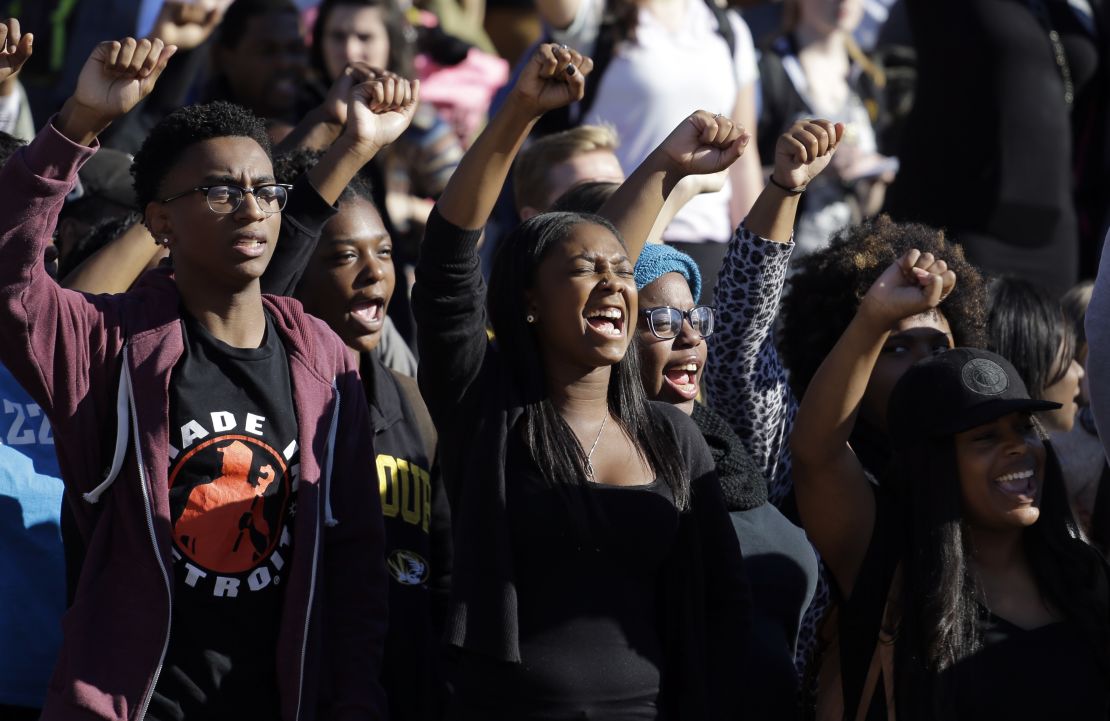 Students cheer while listening to members of the black student protest group Concerned Student 1950 speak, following the announcement that University of Missouri System President Tim Wolfe would resign Monday, Nov. 9, 2015.