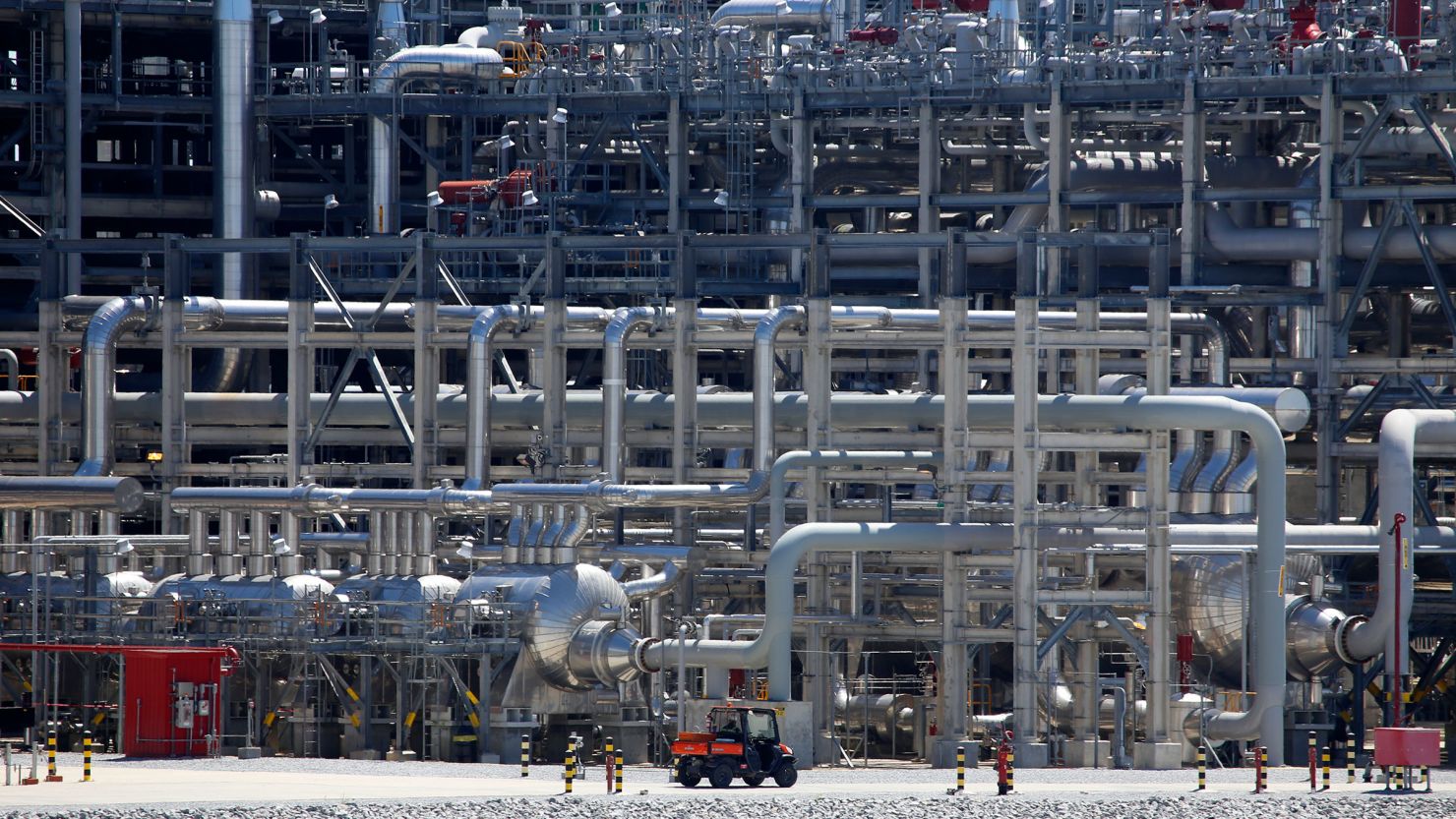 A small vehicle drives past a network of piping tat Cameron LNG export facility in Hackberry, Louisiana, on March 31, 2022.