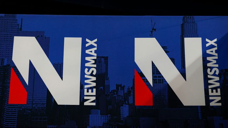A detail view of the Newsmax logo during the National Rifle Association Annual Meeting, Saturday, May 28, 2022, in Houston. The NRA's annual conference is being held for the first time since 2019 due to Covid-19. (Aaron M. Sprecher via AP)