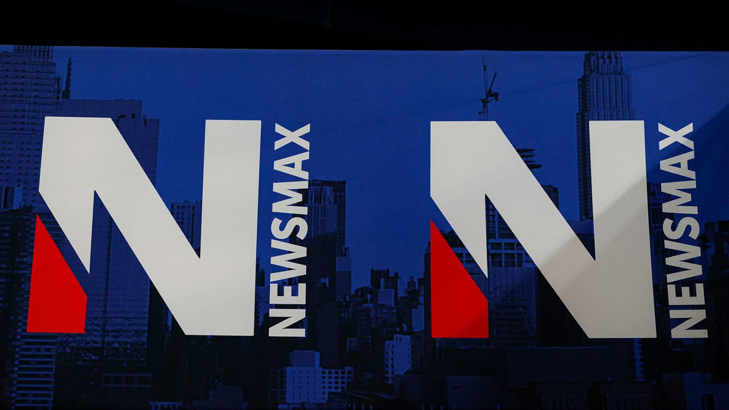 A detail view of the Newsmax logo during the National Rifle Association Annual Meeting, Saturday, May 28, 2022, in Houston.