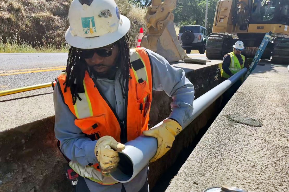 Aaron Morgan, with Pacific Gas & Electric Co., works to install underground power lines in Sonoma County, California, on Monday, June 13, 2022.