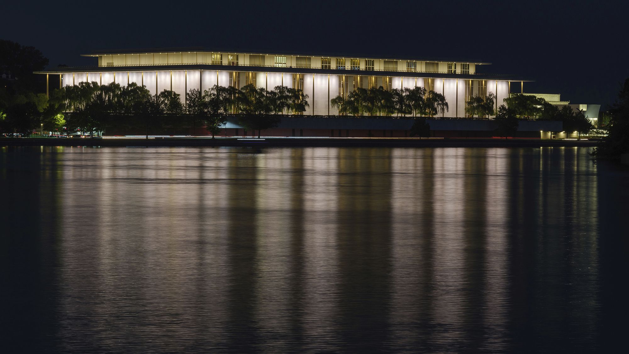 The John F. Kennedy Center for the Performing Arts is reflected in the Potomac River in Washington, September 24, 2022.