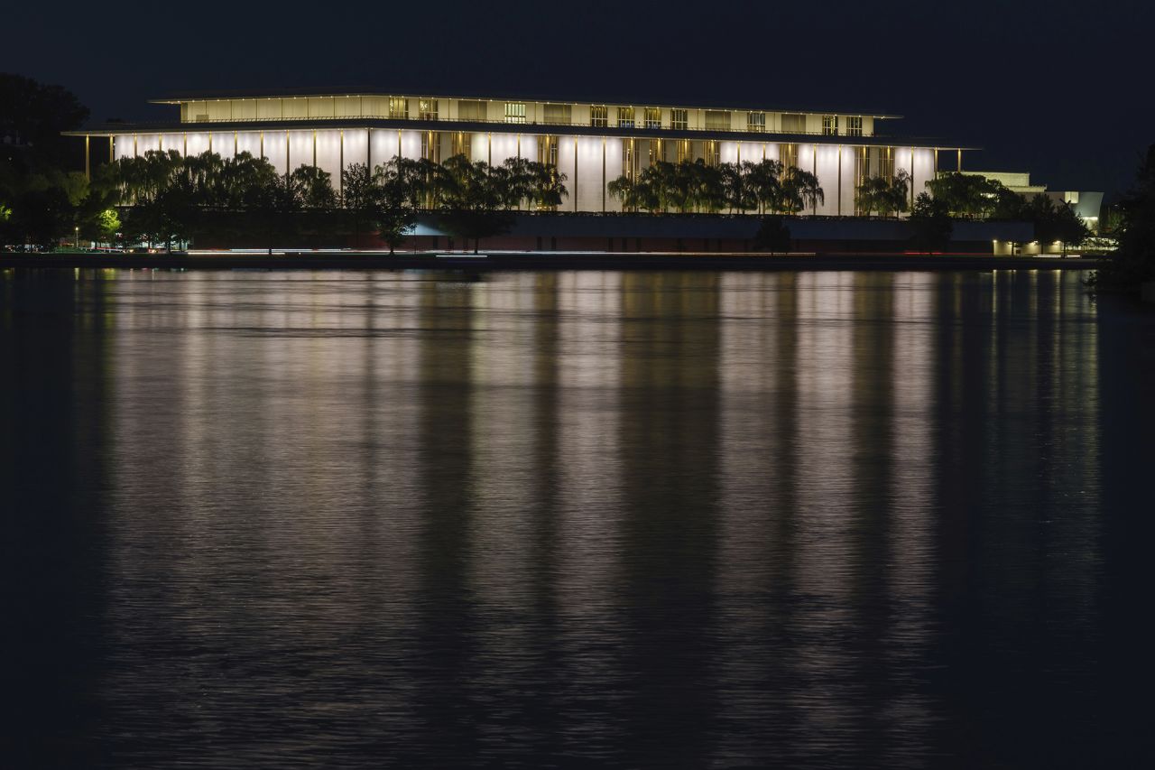 The John F. Kennedy Center for the Performing Arts is reflected in the Potomac River in Washington, DC, on September 24, 2022.