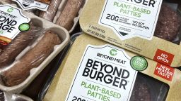 FILE - Beyond Meat products are seen in a refrigerated case inside a grocery store in Mount Prospect, Ill., Saturday, Feb. 19, 2022.  Beyond Meat is cutting about 200 jobs and lowering its full-year revenue outlook as the plant-based meat maker attempts to reduce expenses and become cash flow positive. The company said Friday, Oct. 14,  the job cuts, which amount to approximately 19% of its total global workforce, will be mostly completed by the end of the year.  (AP Photo/Nam Y. Huh, File)