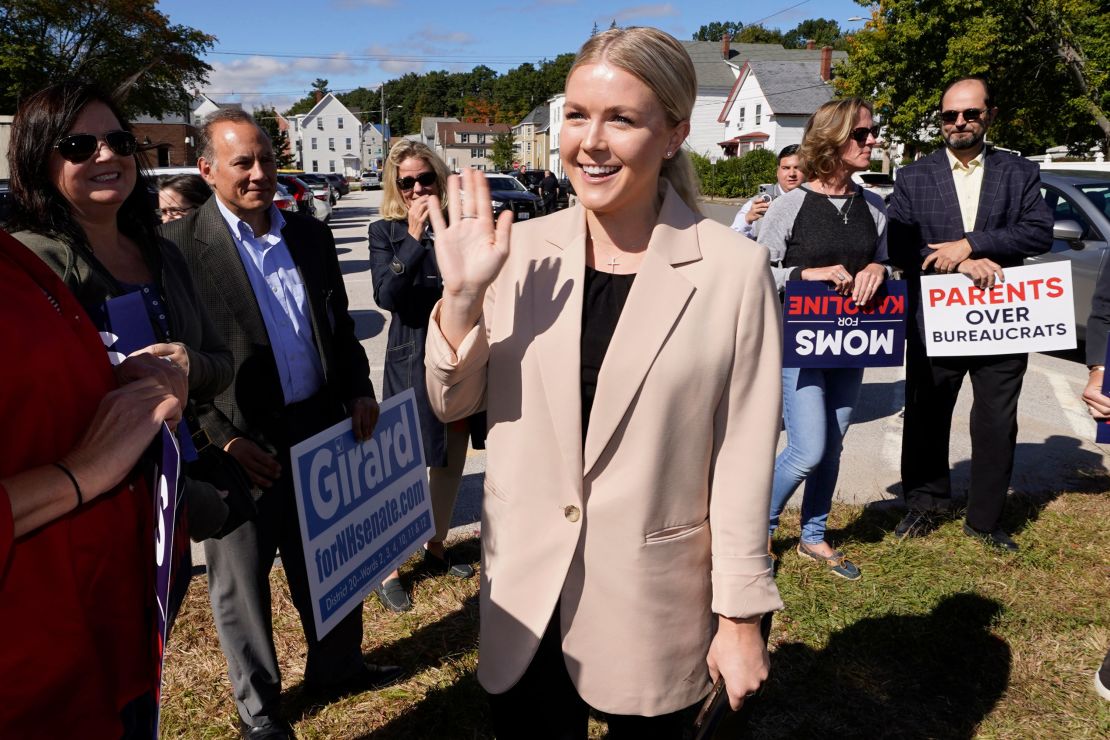 Karoline Leavitt waves to supporters while arriving for a campaign event on September 29, 2022, in Manchester, New Hampshire.