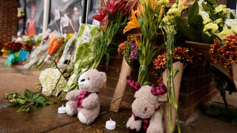 Memorial flowers and stuffed animals line walkway at Scott Stadium after three football players were killed in a shooting on the grounds of the University of Virginia Tuesday Nov. 15, 2022, in Charlottesville. Va.