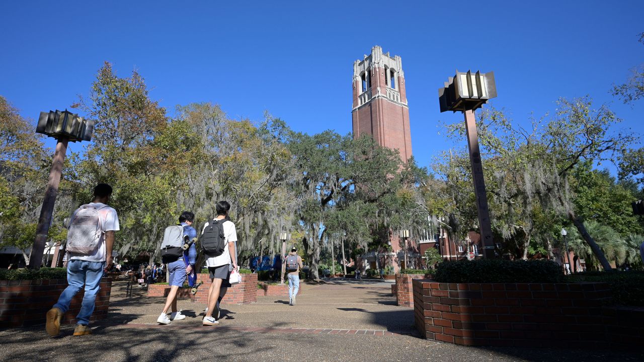 Students walk through the University of Florida campus on the last day of regular classes for the semester before finals testing week, Wednesday, Dec. 7, 2022, in Gainesville, Fla. (Phelan M. Ebenhack via AP)