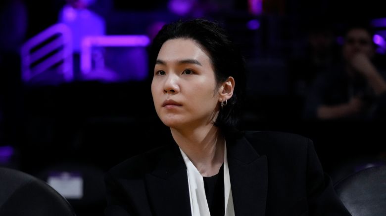 BTS member Suga attends an NBA basketball game between the Los Angeles Lakers and the Dallas Mavericks in Los Angeles, on January 12, 2023.
