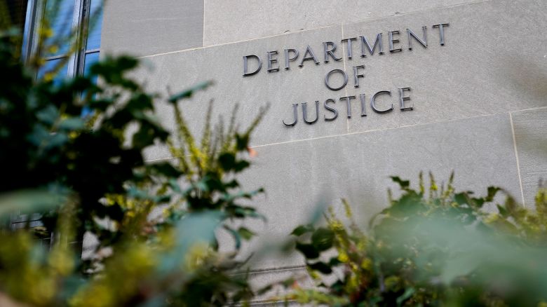 A sign marks an entrance to the Robert F. Kennedy Department of Justice Building in Washington, DC, in January 2023.