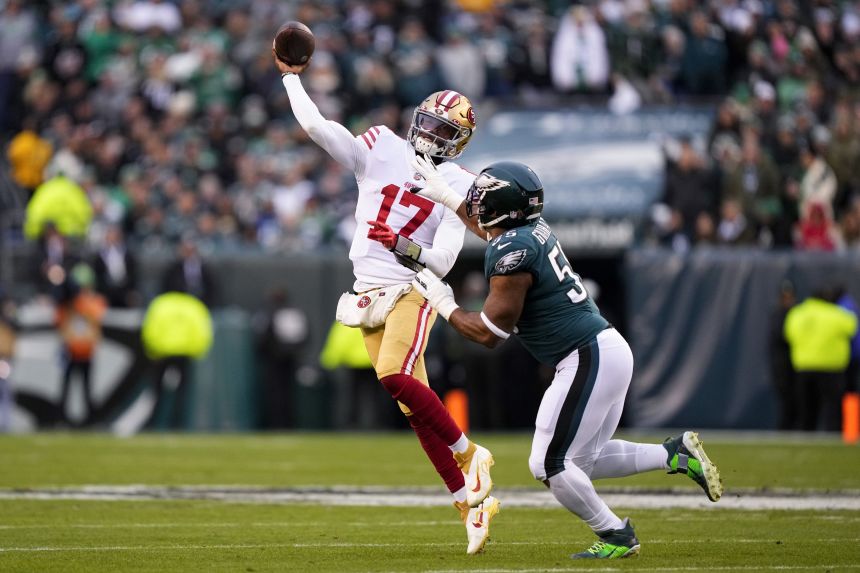 Johnson (left) made his NFL playoff debut in the NFC Championship game for the 49ers against the Philadelphia Eagies in 2023. He replaced the injured Brock Purdy but left shortly afterwards with a concussion.