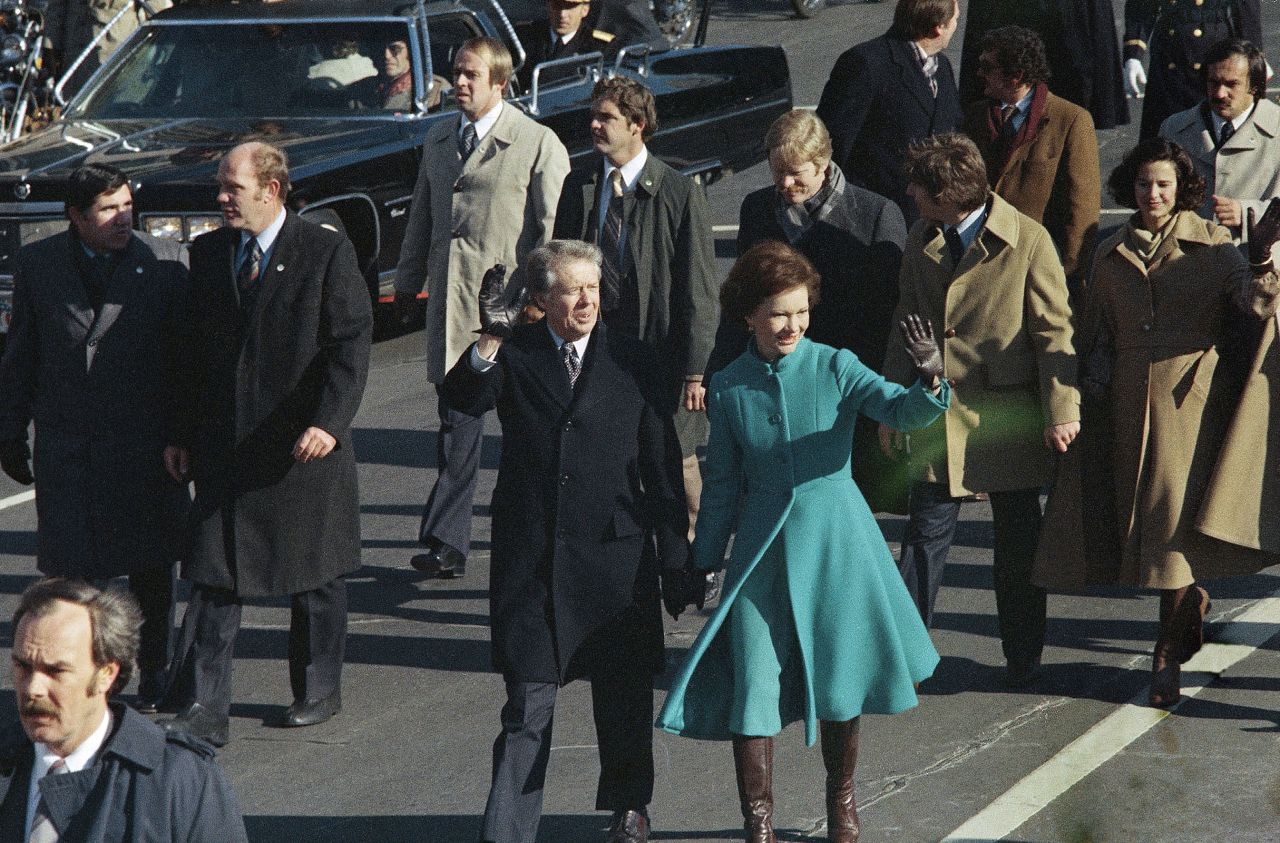 Jimmy Carter and first lady Rosalynn Carter walk down Pennsylvania Avenue in Washington, DC, after Carter was sworn in as the nation's 39th president, on January 20, 1977.