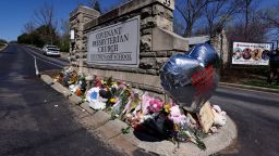 A balloon with names of the victims is seen at a memorial at the entrance to The Covenant School on Wednesday, March 29, 2023, in Nashville, Tenn.