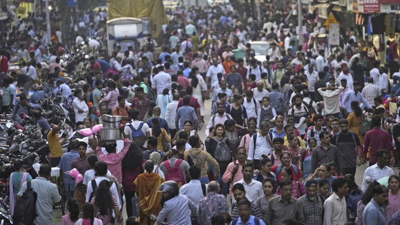A crowd walks in a market area outside Dadar station in Mumbai, India, Friday, March 17, 2023. India will soon eclipse China to become the world's most populous country, and its economy is among the fastest-growing. But the number of Indian women in the workforce, already among the 20 lowest in the world, has been shrinking for decades.