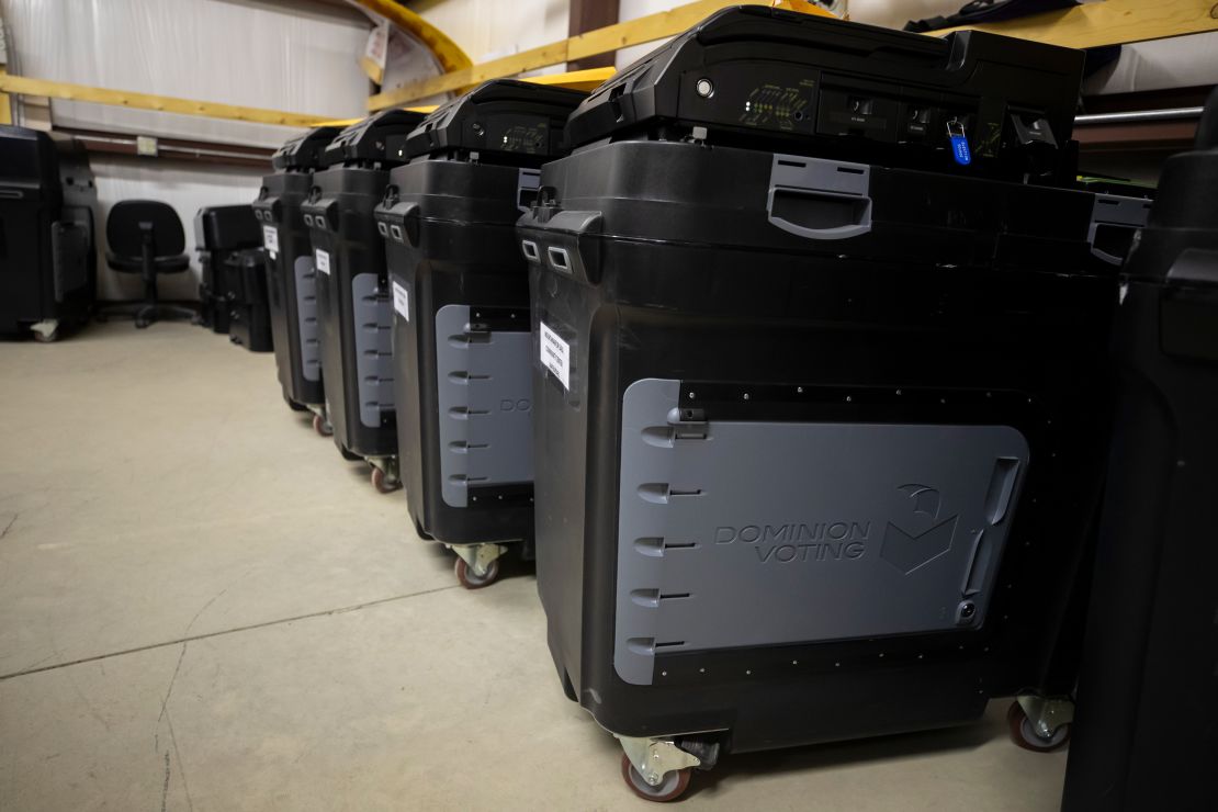 Dominion Voting Systems ballot-counting machines are lined up at a Torrance County warehouse during testing of election equipment with local candidates and partisan officers in Estancia, New Mexico, on September 29, 2022.