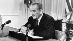 FILE - President Lyndon Johnson tells a nationwide audience that he would not seek nor accept 