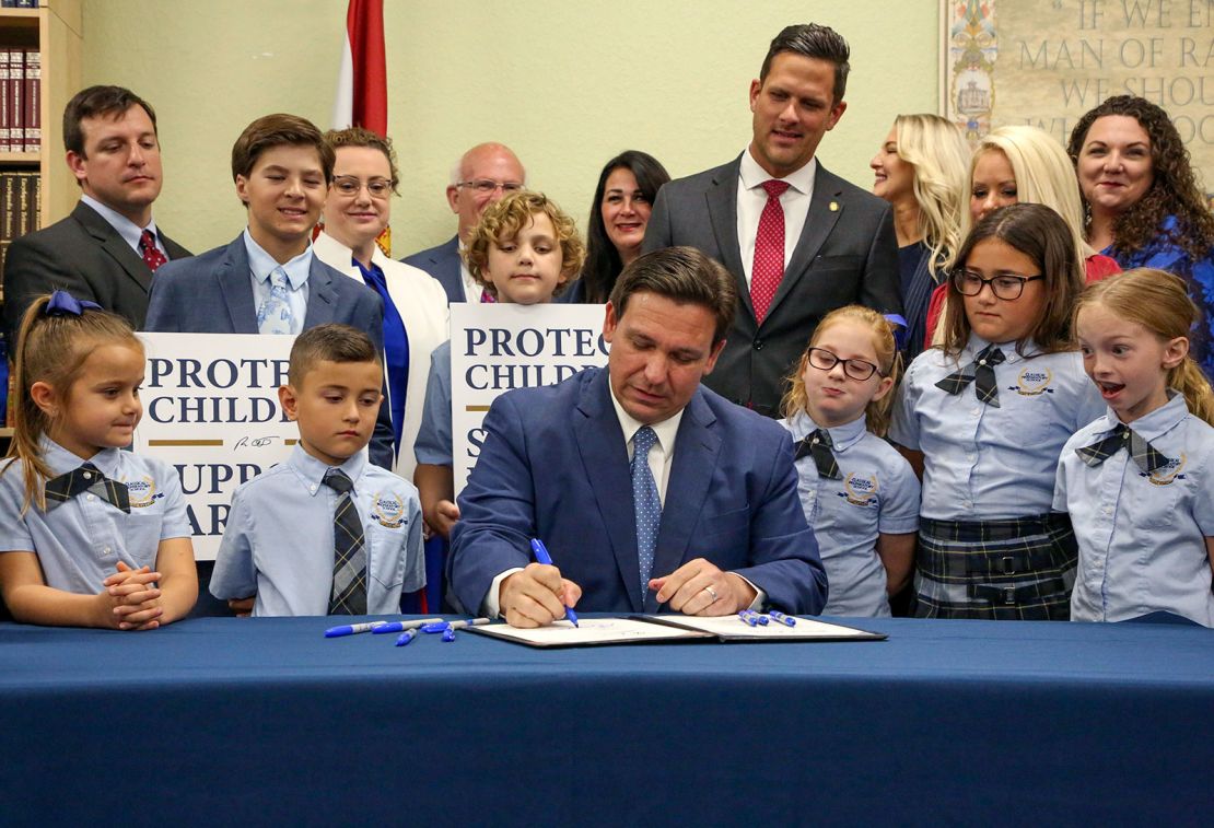 Florida Gov. Ron DeSantis signs the Parental Rights in Education bill on March 28, 2022, in Shady Hills, Florida.