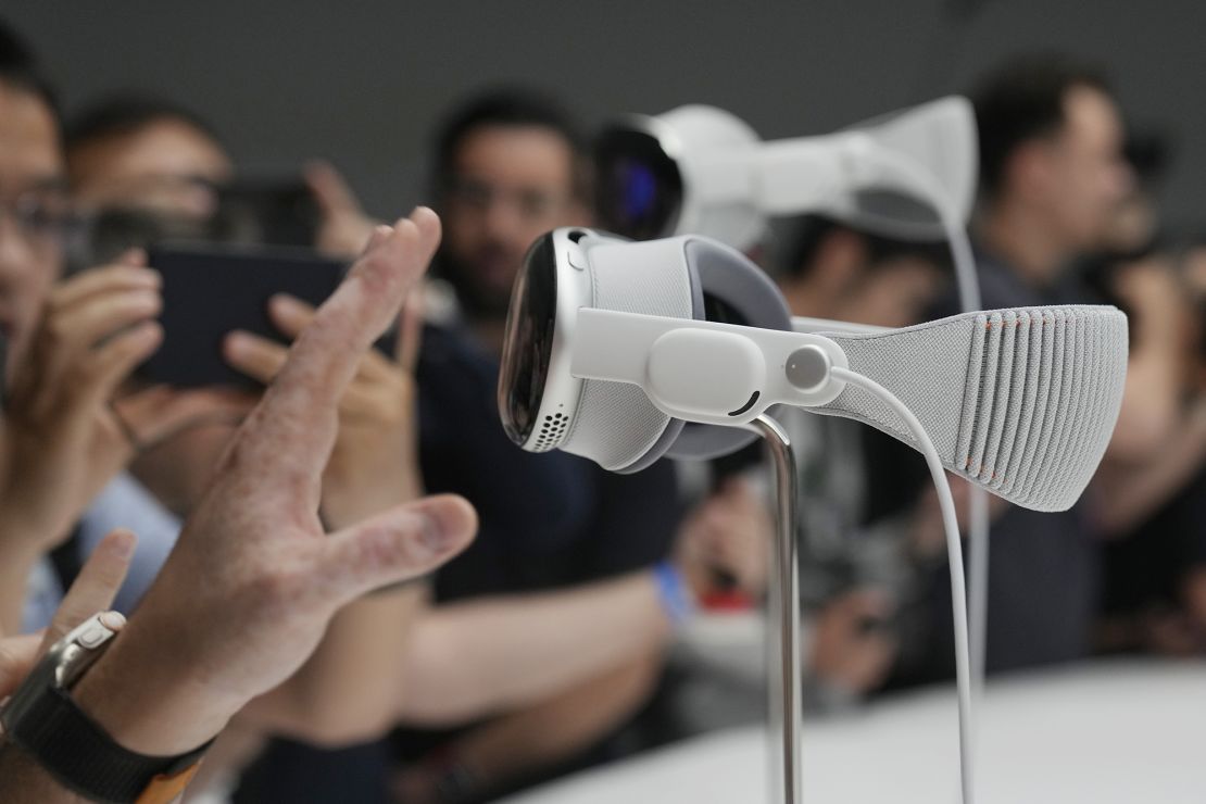 The Apple Vision Pro headset is displayed in a showroom on the Apple campus in Cupertino, Calif., after it's introduction at the company's annual developers conference, Monday, June 5, 2023. The Vision Pro is a high-priced headset that blends virtual reality with augmented reality that projects digital images on top of real-world settings.