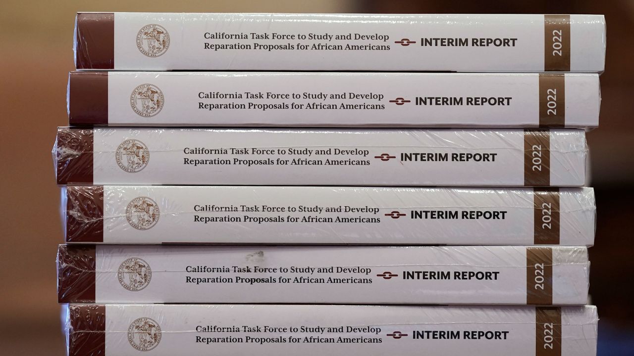 FILE - Copies of the interim report issued by California's first-in-the-nation task force on reparations for African Americans are seen at the Capitol in Sacramento, Calif., on June 16, 2022. California's first-in-the-nation reparations task force wraps up its historic work Thursday, June 29, 2023, with the formal submission to lawmakers of a final report that includes dozens of recommendations on how the state can apologize and compensate Black residents for decades of discriminatory practices and policies. (AP Photo/Rich Pedroncelli, File)