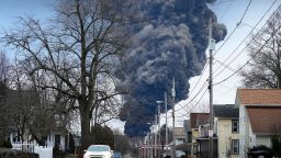 FILE - A black plume rises over East Palestine, Ohio, as a result of a controlled detonation of a portion of the derailed Norfolk Southern trains, Feb. 6, 2023. On Thursday, June 29, the railroad industry filed suit to block a new minimum crew-size requirement that Ohio imposed after a fiery train derailment in East Palestine in February. (AP Photo/Gene J. Puskar, File)