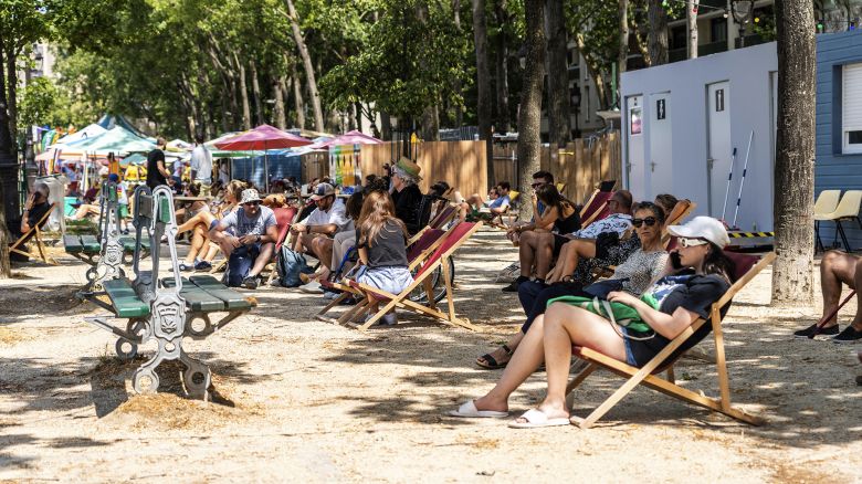 Parisian resting because of the very strong heat wave at the launch of paris plage, which is a summer operation carried out by the mayor of Paris since 2002. Every year, between mid-July and the beginning of September, over 3.5 km, the track on the right bank of the Seine and the place de l he HÃ'tel-de-Ville as well as adjoining sites â such as the Bassin de la Villette since 2007 â host recreational and sporting activities, sandy and grassy beaches, palm trees. Motor traffic is interrupted on this portion of the Georges-Pompidou expressway for the duration of the operation, from its installation to its dismantling on July 8, 2023 in Paris.//04SIPA_JUMEAU0667/Credit:ALEXIS JUMEAU/SIPA/2307091252 (Sipa via AP Images)