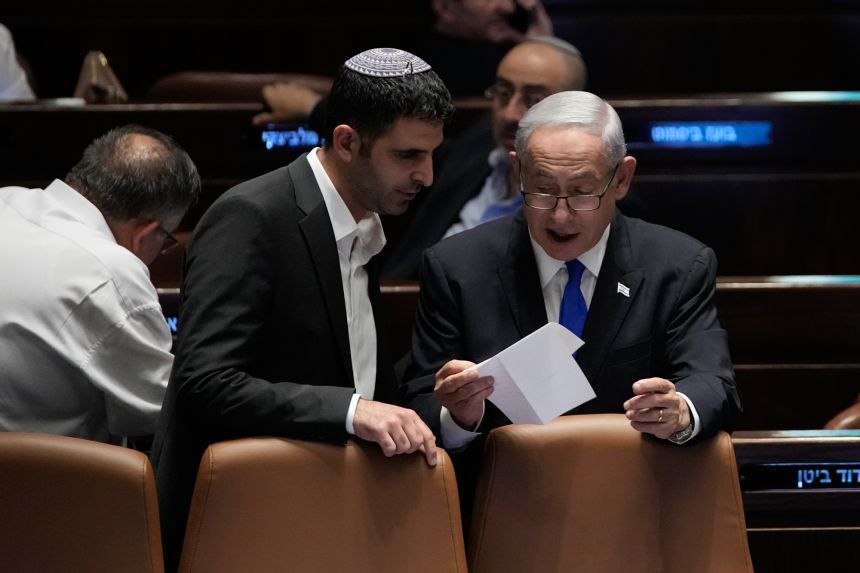 Israeli Prime Minister Benjamin Netanyahu (right) speaks with Communications Minister Shlomo Karhi at the Knesset in Jerusalem in 2023.