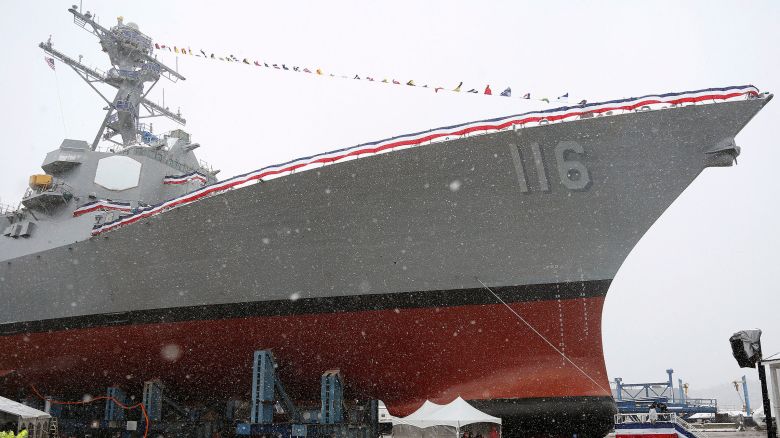 In this 2017 photo, Snow falls on the USS Thomas Hudner, a US Navy destroyer named after Korean War veteran Thomas Hudner, during christening ceremony at Bath Iron Works in Bath, Maine, April 1, 2017.