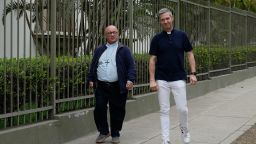 Vatican investigators, Archbishop Charles Scicluna, from Malta, left, and Monsignor Jordi Bertomeu, from Spain, walk outside of the Nunciatura Apostolica during a break from meeting with people who allege abuse by the Catholic lay group Sodalitium Christianae Vitae (SCV) in Lima, Peru, Tuesday, July 25, 2023.