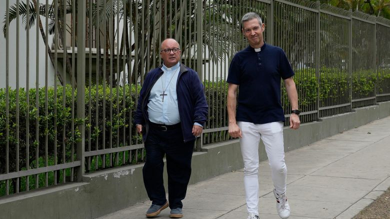Vatican investigators, Archbishop Charles Scicluna, from Malta, left, and Monsignor Jordi Bertomeu, from Spain, walk outside of the Nunciatura Apostolica during a break from meeting with people who allege abuse by the Catholic lay group Sodalitium Christianae Vitae (SCV) in Lima, Peru, Tuesday, July 25, 2023.