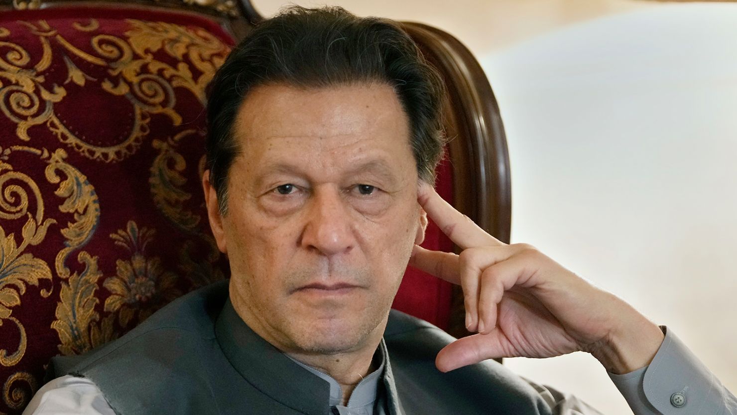 Pakistan's former prime minister Imran Khan listens to a member of media during talk with reporters, in Lahore, Pakistan, on August 3, 2023.