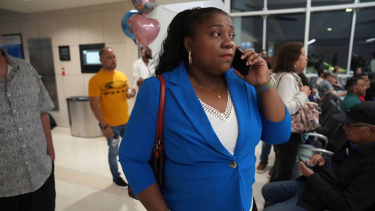 Valerie Laveus waits for her brother Reginald Malherbe Daniel and nephew Tristan-Ryan Malherbe Daniel, as they arrive for the first time to the United States from Haiti at Fort Lauderdale-Hollywood International Airport, in Fort Lauderdale, Fla., Wednesday, Aug. 9, 2023. (AP Photo/Jim Rassol)