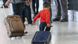 EMBARGOED TO 0001 TUESDAY AUGUST 15 File photo dated 26/08/2023 of a young boy pulling a suitcase as refugees arrive from Afghanistan at Heathrow Airport, London. Many Afghan families have been let down by the promised warm welcome to the UK, a think tank said as it called for lessons to be learned so future groups of refugees can be better supported. More In Common, an organisation founded in the wake of the murder of Labour MP Jo Cox, recognised the success of efforts to settle thousands of people into permanent accommodation after fleeing the Taliban takeover two years ago. Issue date: Tuesday August 15, 2023. 73332846 (Press Association via AP Images)