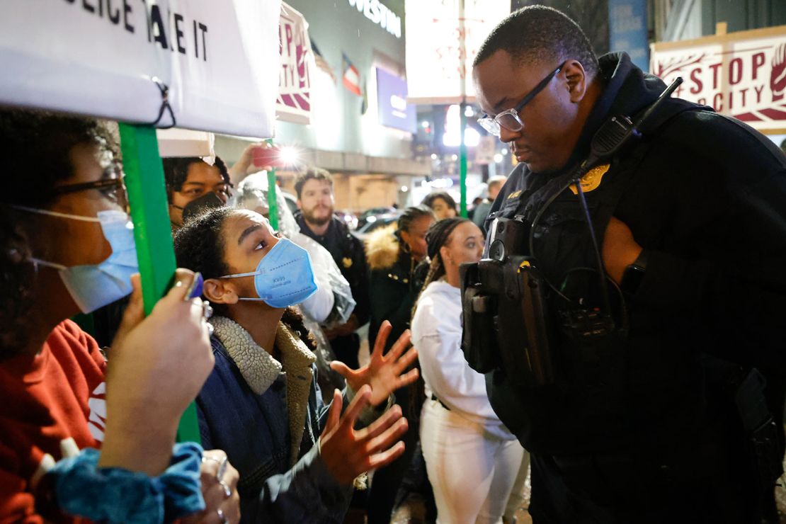 In this March 9, 2023 photo, demonstrators confront an Atlanta police officer during a protest over plans to build a new police training center, in Atlanta. Sixty-one people have been indicted in Georgia on racketeering charges following a long-running state investigation into protests against a proposed police and training facility in the Atlanta area that critics call “Cop City.”