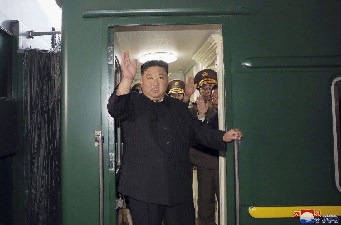 In this photo provided by the North Korean government, North Korea leader Kim Jong Un waves from a train in Pyongyang, North Korea, on September 10, 2023, as he leaves for Russia.