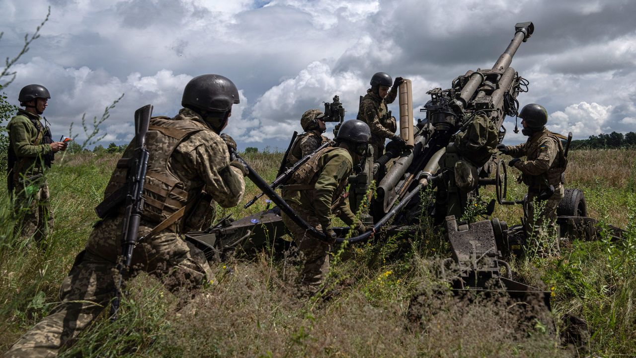 In this July 2022 photo, Ukrainian servicemen prepare to fire at Russian positions from a US-supplied M777 howitzer in Kharkiv region of Ukraine.
