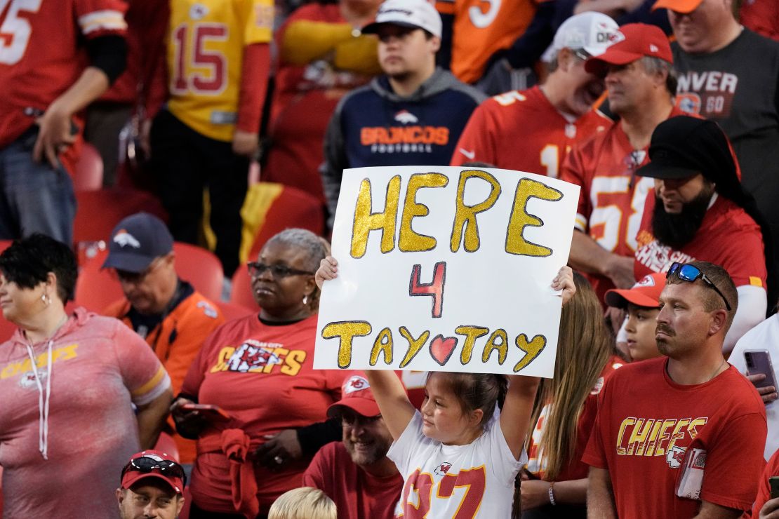 A Kansas City Chiefs fan holds a sign about Taylor Swift before an NFL football game between the Kansas City Chiefs and the Denver Broncos in October 2023.