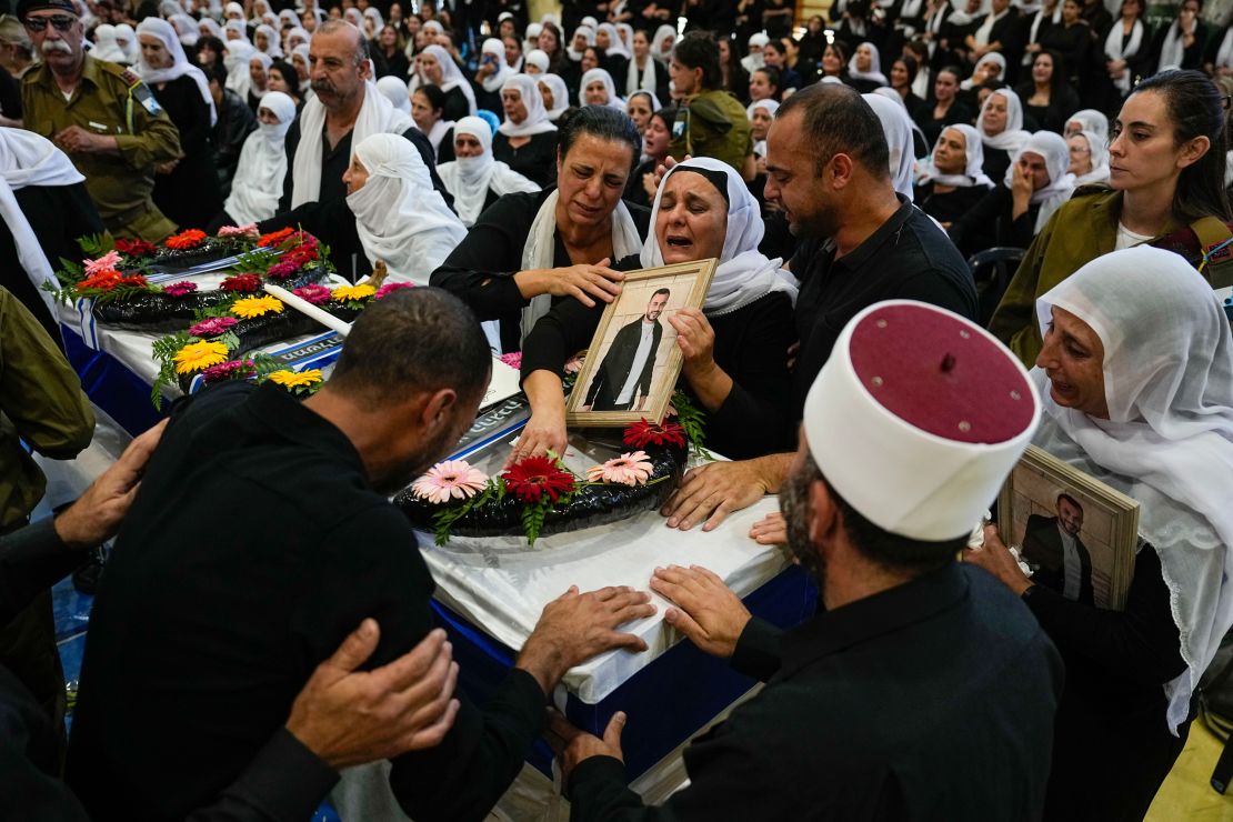 Mourners gather around the coffin of Druze Israeli Lt. Col. Salman Habaka in the village of Yanuh Jat, northern Israel, on November 3. Habaka was killed during a ground operation in the Gaza Strip.