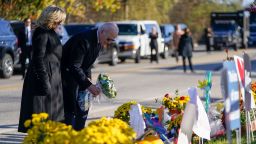 President Joe Biden and first lady Jill Biden lay flowers at Schemengees Bar and Grille, one of the sites of last week's mass shooting, on Friday in Lewiston, Maine.