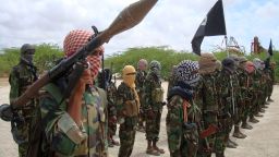 In this 2010 file photo, al-Shabaab fighters display weapons as they conduct military exercises in northern Mogadishu, Somalia.