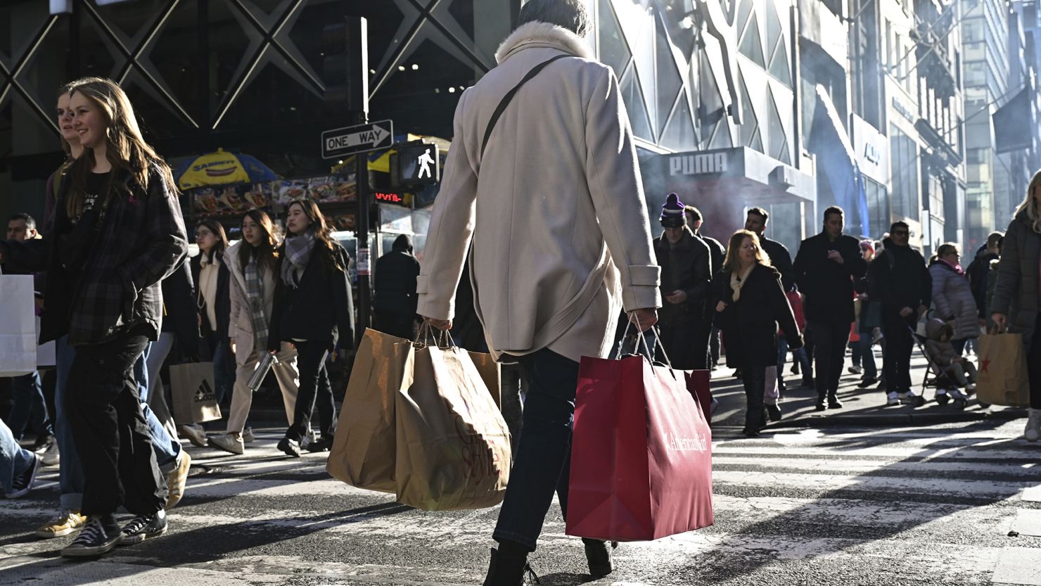 Shoppers along Fifth Avenue in New York City on Black Friday, November 24, 2023. Strong consumer spending has helped propel US economic growth this year.