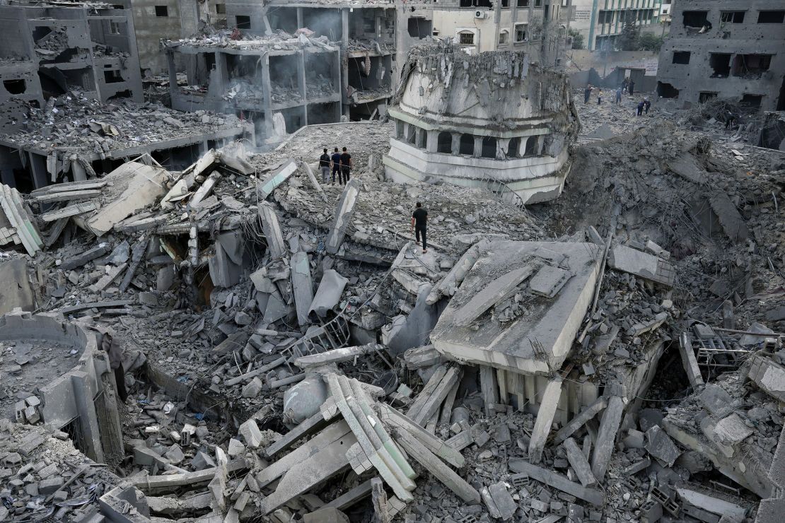 Palestinians inspect the rubble of the Yassin Mosque, destroyed after it was hit by an Israeli airstrike.