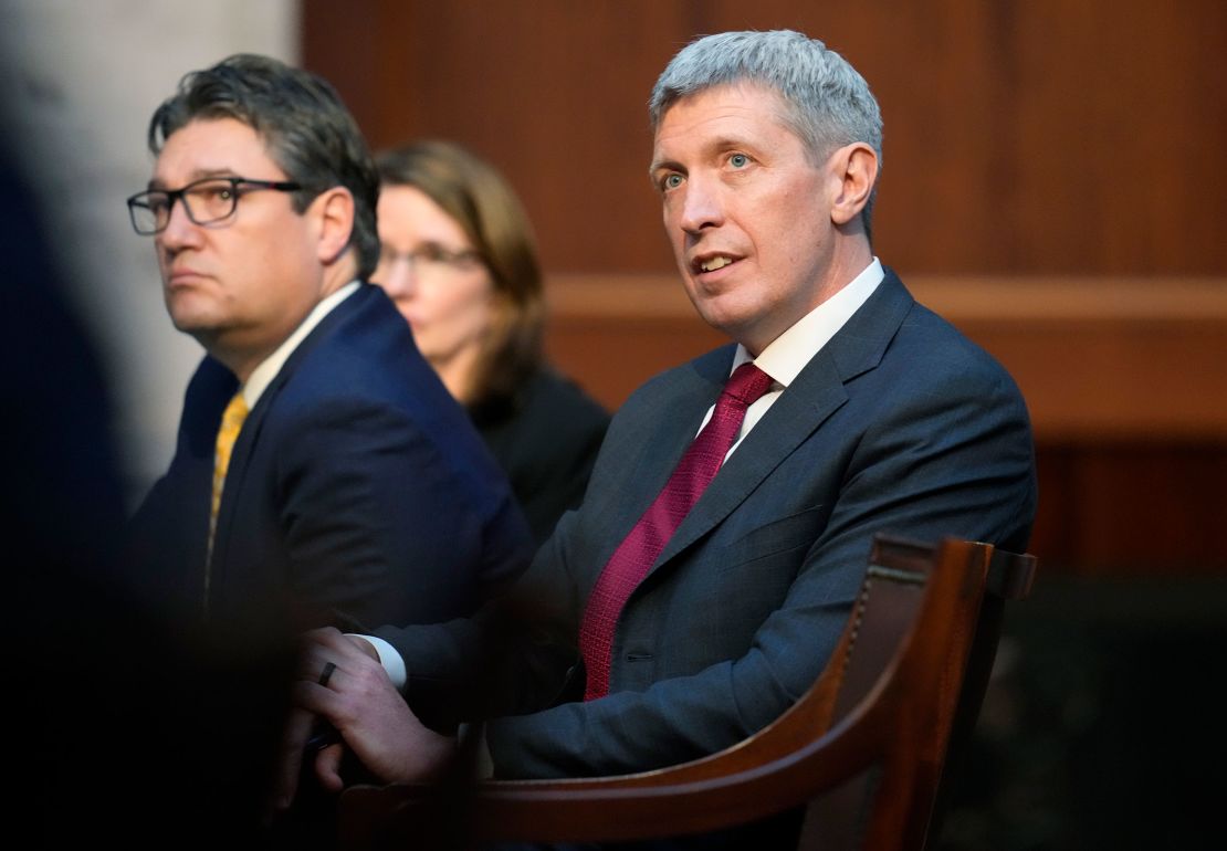 Attorneys Eric Olson, right, and Sean Grimsley listen as Jason Murray argues before the Colorado Supreme Court on Wednesday, Dec. 6, 2023, in Denver.