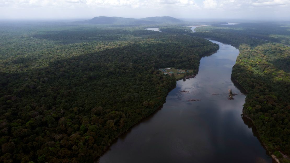 The Essequibo River flows through Kurupukari crossing in Guyana on November 19, 2023. Venezuela has long claimed Guyana's Essequibo region, a territory larger than Greece and rich in oil and minerals.