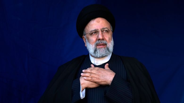 Iranian President Ebrahim Raisi places his hands on his heart as a gesture of respect to the crowd during a funeral ceremony in Tehran, Iran, on  January 5, 2024.