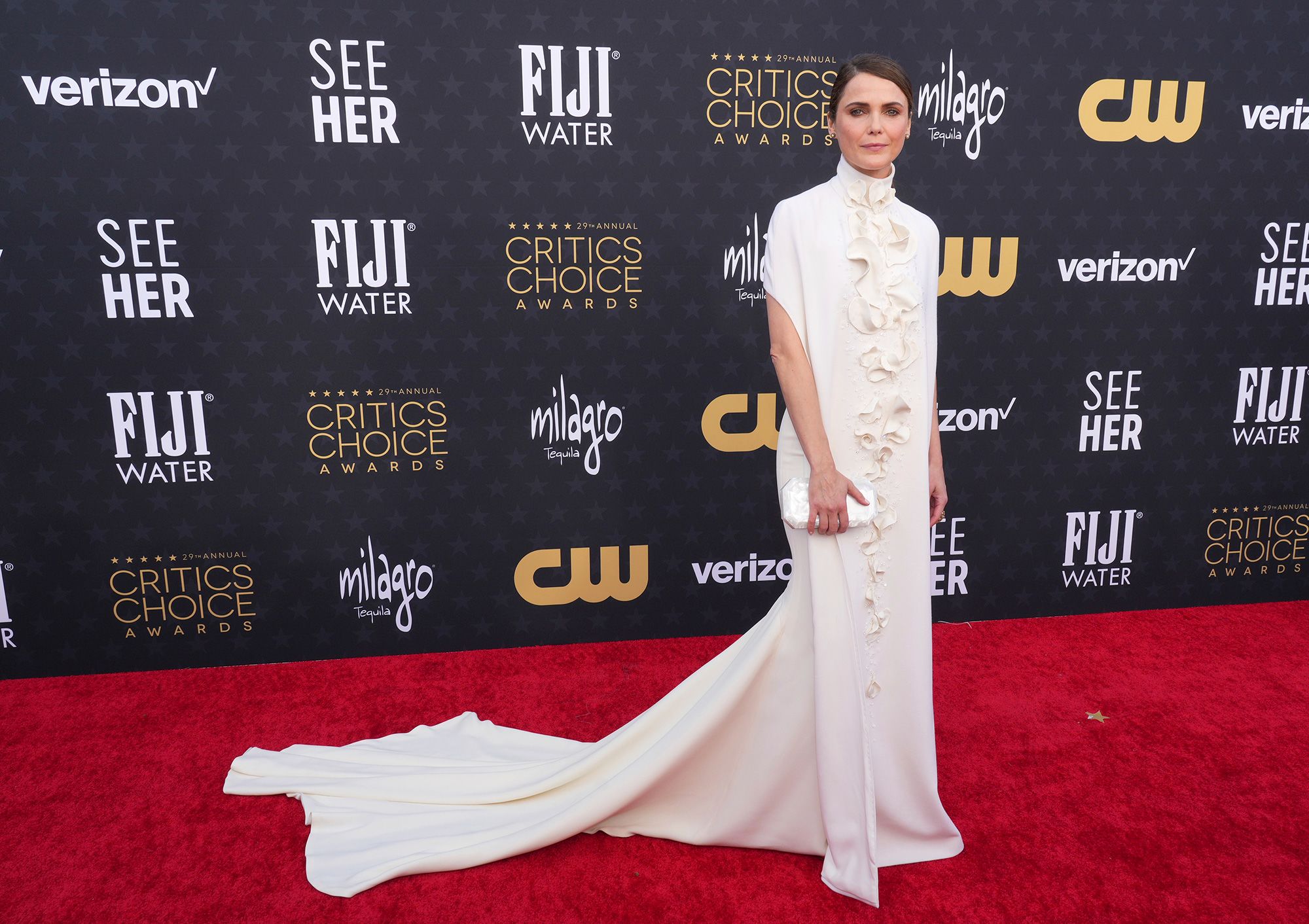 Keri Russell, who stars in “The Diplomat,” wore a sleek Stéphane Rolland number with a high collar and ruffles. She accessorized with diamond and petrified wood jewelry from Fernando George.